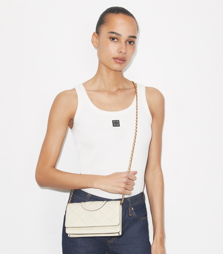 Tory Burch designer mini bags Fleming Crossbody in Light Cream accessory on model