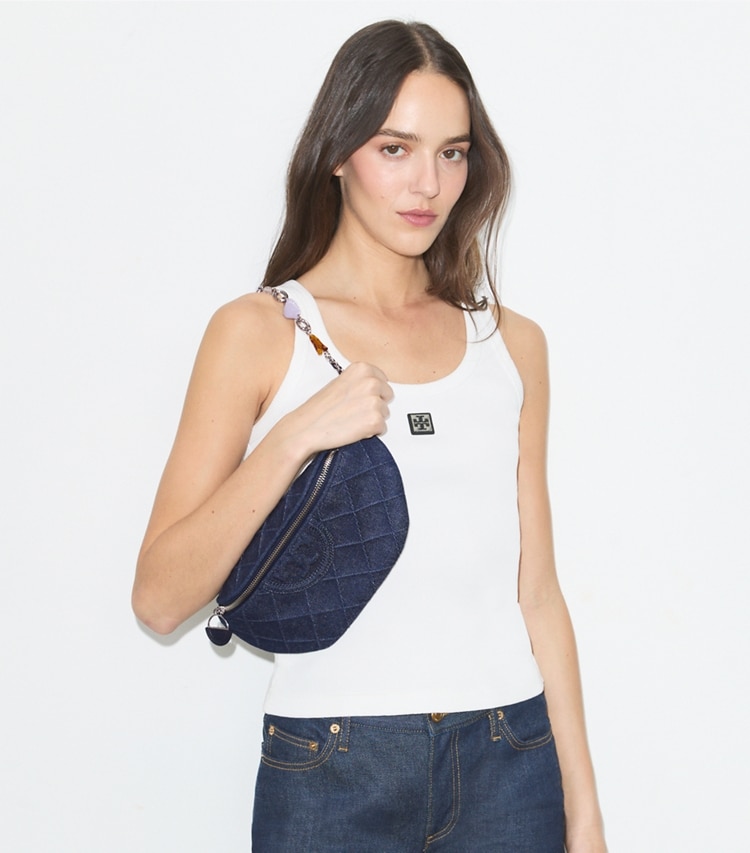 Tory Burch designer belt bags Fleming Denim Charm Belt Bag in Blue additional on model