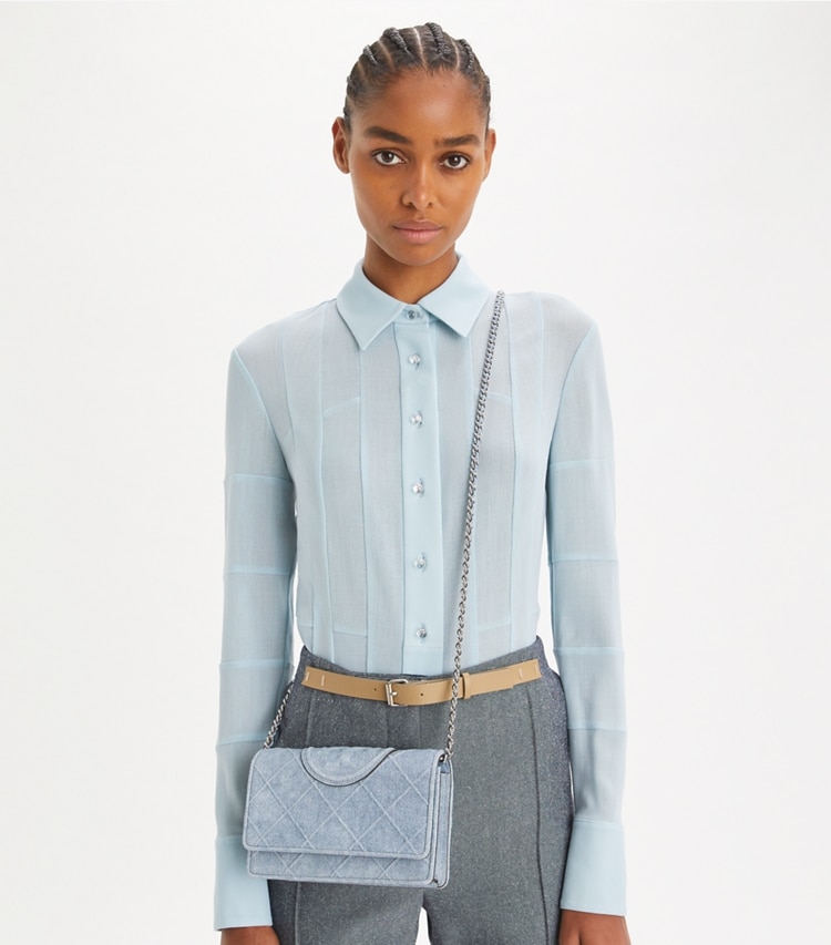 Tory Burch designer mini bags Fleming Denim-Print Suede Crossbody in Denim accessory on model