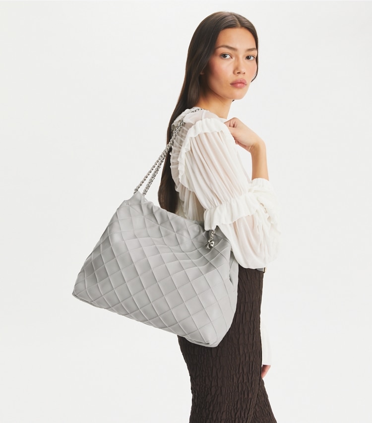 Tory Burch designer hobo bags Fleming Drawstring Bag in Gray accessory on model