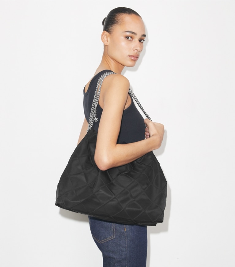 Tory Burch designer hobo bags Fleming Hobo Bag aus Nylon in Black accessory on model