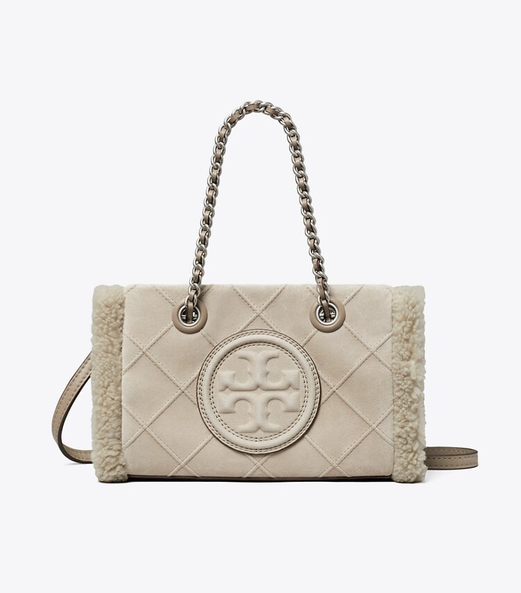 Tory Burch designer crossbody bags Fleming Mini Tote Bag mit weichem Lammfell und Kettenriemen in Cotton Grey front