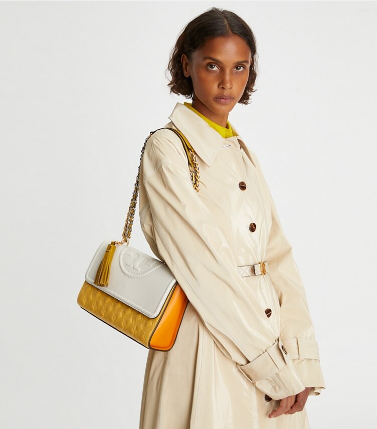 Tory Burch designer shoulder bags Fleming Parrot Small Convertible Shoulder Bag in NEW IVORY / Golden Sunset accessory on model
