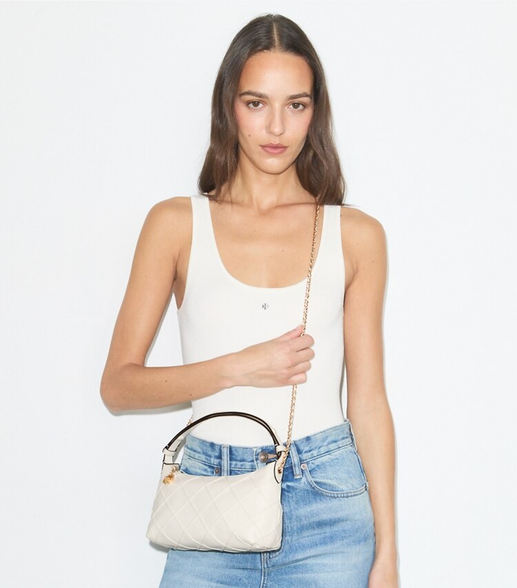 Tory Burch designer crossbody bags Fleming Pochette in Light Cream accessory on model