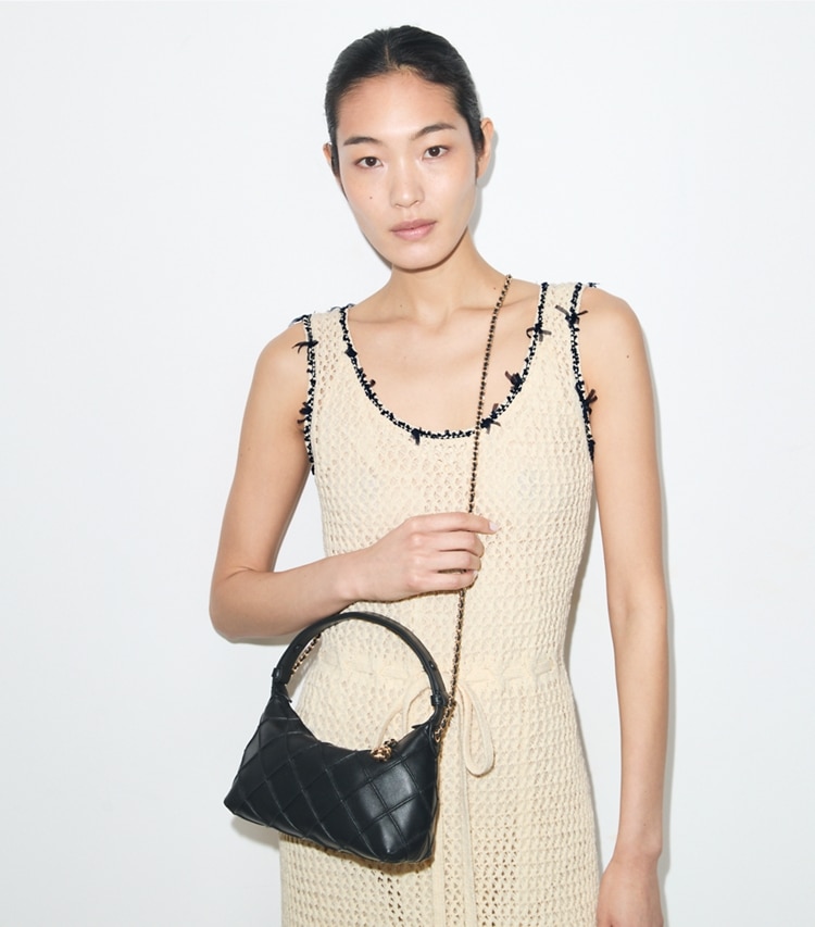 Tory Burch designer crossbody bags Fleming Pochette in Black additional on model