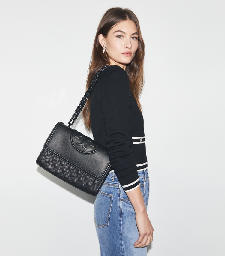 Tory Burch designer shoulder bags Fleming Polished-Grain Convertible Shoulder Bag in Black/Black accessory on model