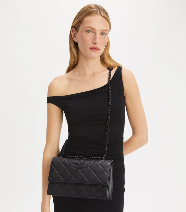 Tory Burch designer shoulder bags Fleming Polished-Grain Convertible Shoulder Bag in Black/Black additional on model