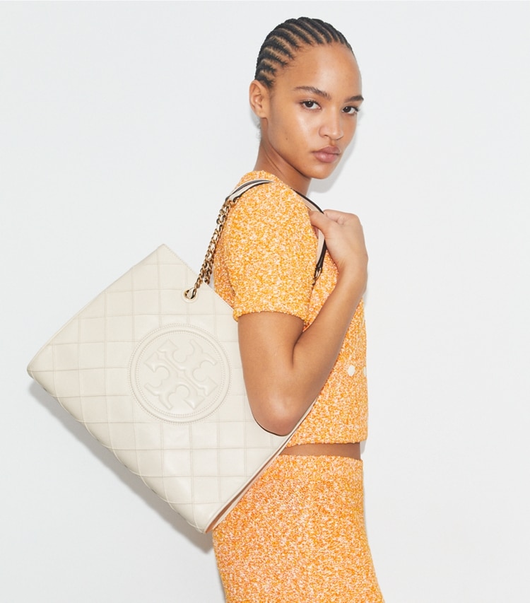 Tory Burch designer tote bags Fleming Soft Chain Tote in New Cream accessory on model