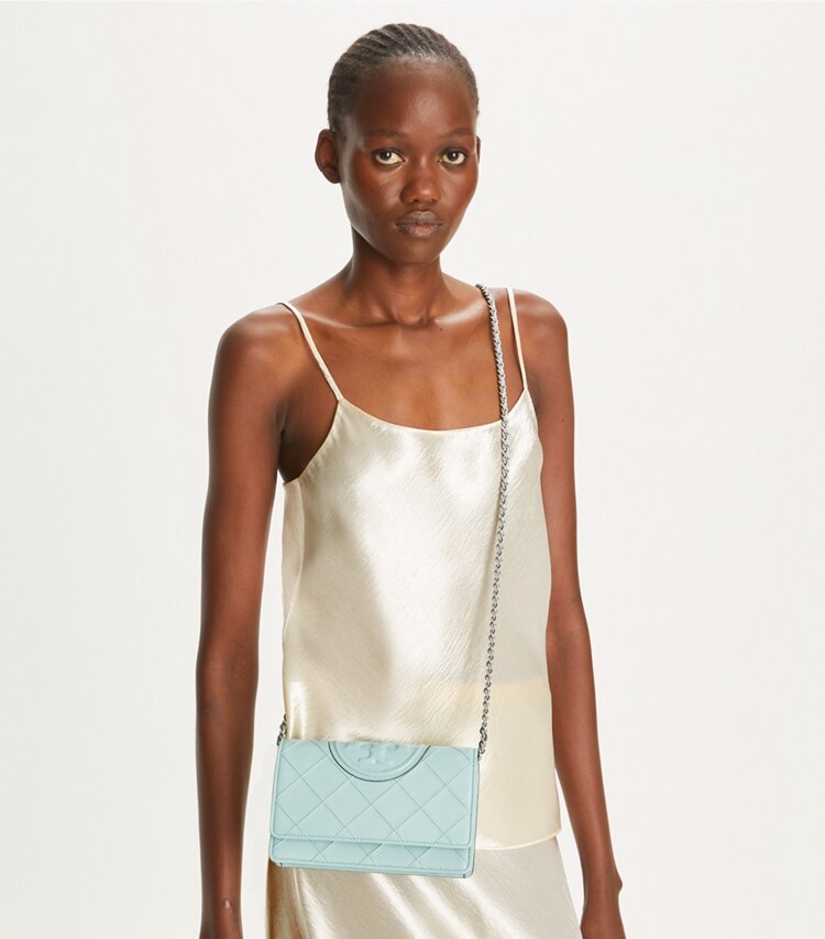 Tory Burch designer mini bags Fleming Soft Crossbody in Geyser accessory on model