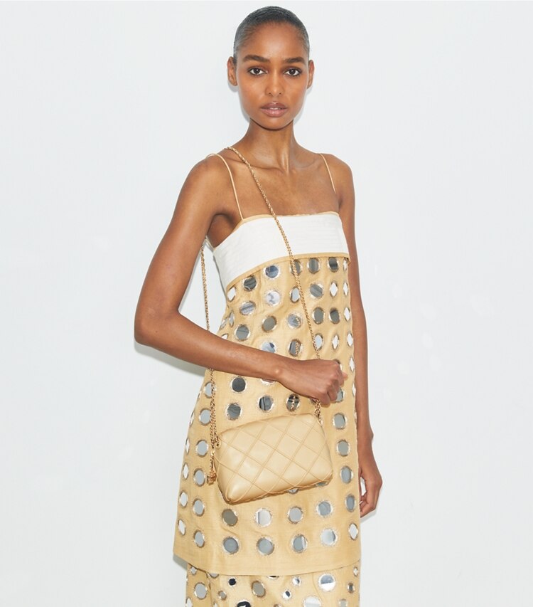 Tory Burch designer crossbody bags Fleming Soft Crossbody Bag in Vanilla Soft Serve accessory on model