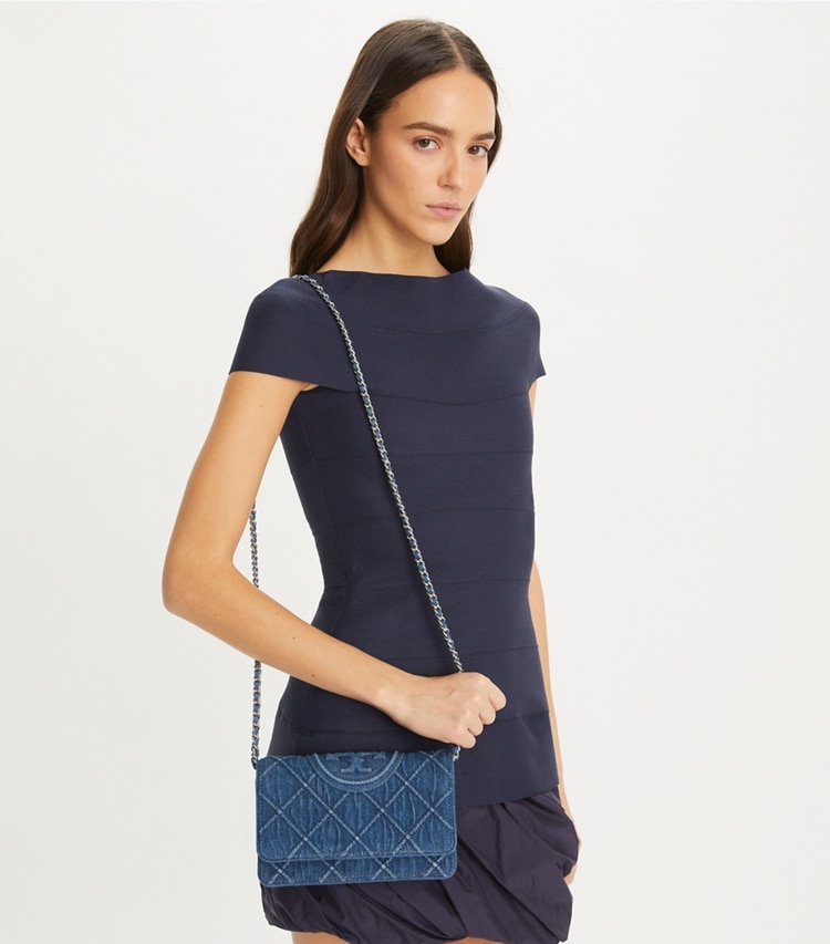 Tory Burch designer mini bags Fleming Soft Denim Crossbody in Denim accessory on model