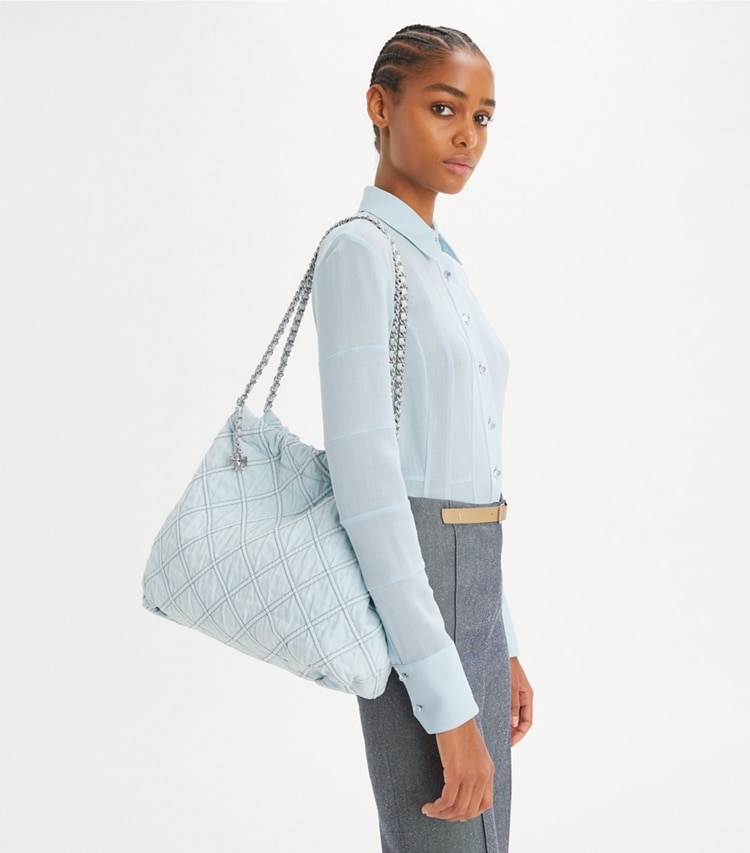 Tory Burch designer hobo bags Fleming Soft Denim Hobo Bag in Seltzer accessory on model