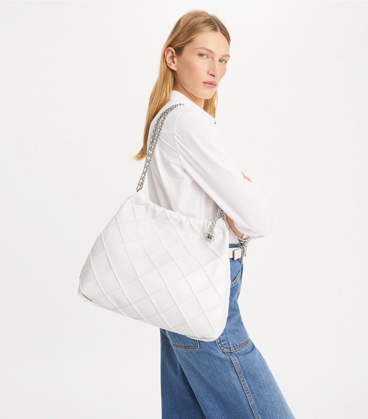 Tory Burch designer hobo bags Fleming Soft Distressed Hobo Bag in Blanc accessory on model