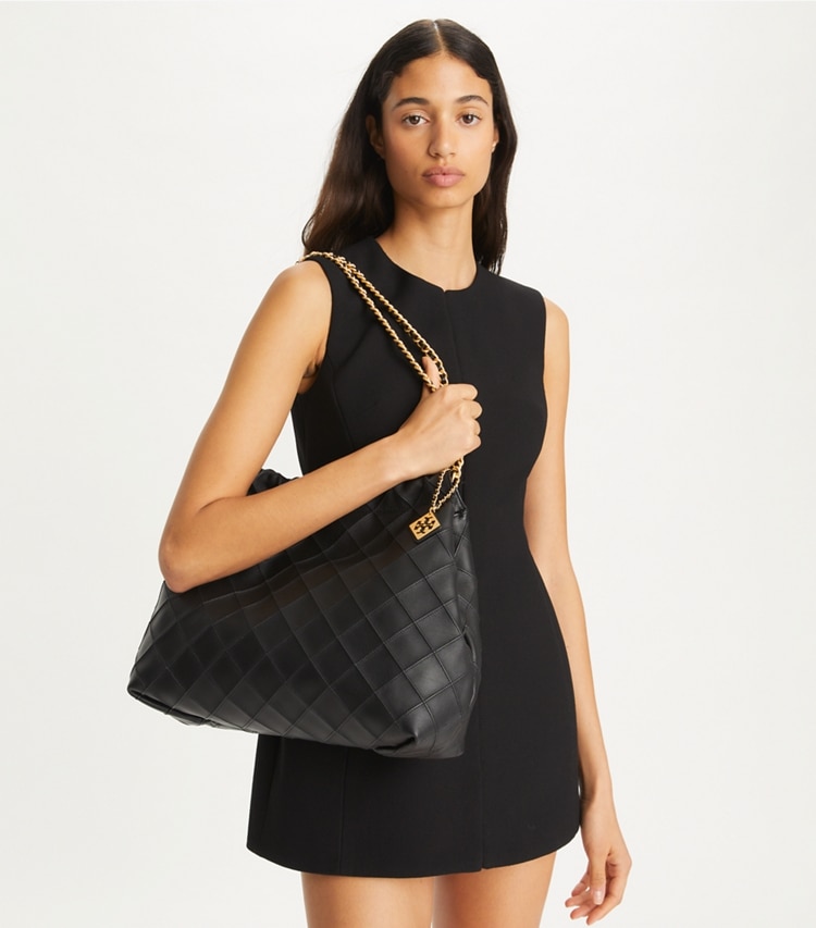 Tory Burch designer hobo bags Fleming Soft Hobo Bag in Black accessory on model