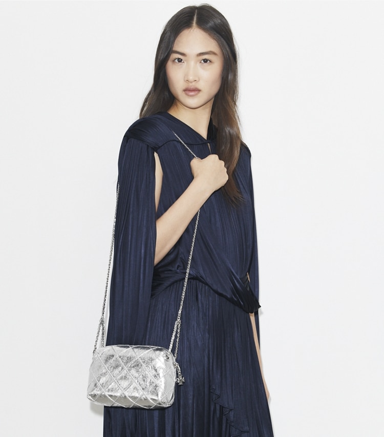 Tory Burch designer crossbody bags Fleming Soft Metallic Crossbody Bag in Silver accessory on model