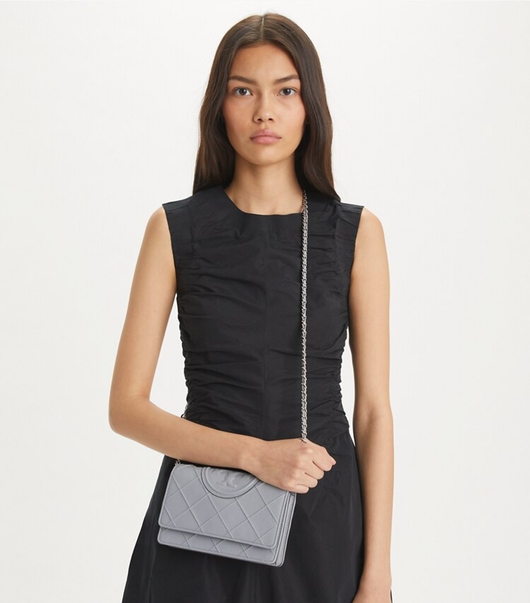Tory Burch designer mini bags Fleming Soft Polished-Grain Crossbody in Slate accessory on model