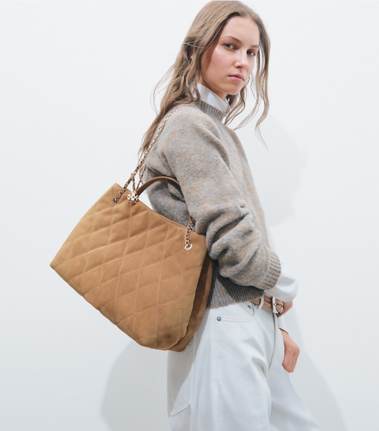 Tory Burch designer satchels Fleming Suede Carryall in Toffee accessory on model