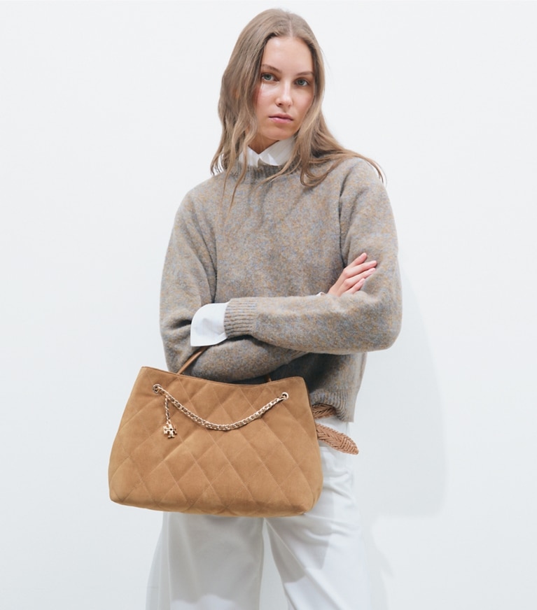 Tory Burch designer satchels Fleming Suede Carryall in Toffee additional on model