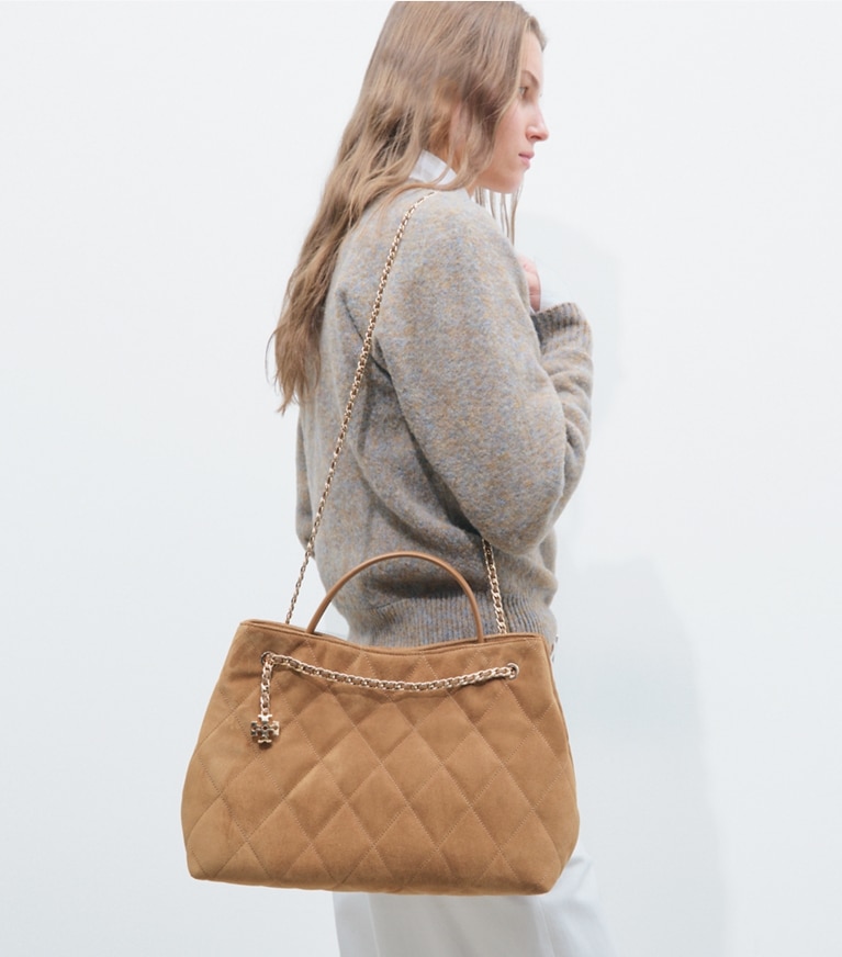 Tory Burch designer satchels Fleming Suede Carryall in Toffee additional on model