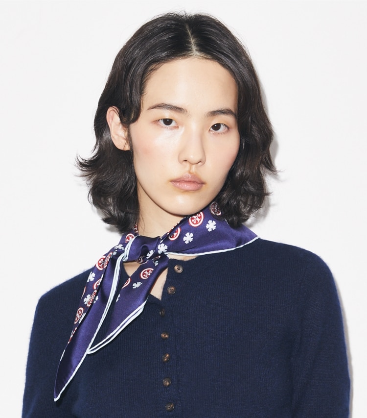 Tory Burch designer scarves Floral Logo Triangle Scarf in Navy Floral Logo accessory on model