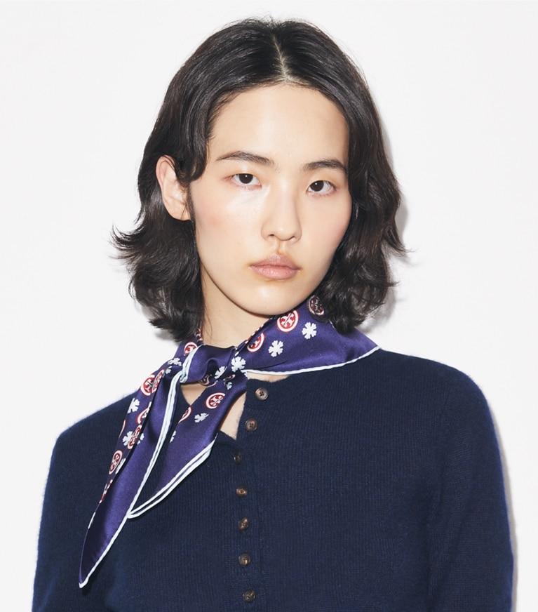 Tory Burch designer scarves Floral Logo Triangle Scarf in Navy Floral Logo accessory on model