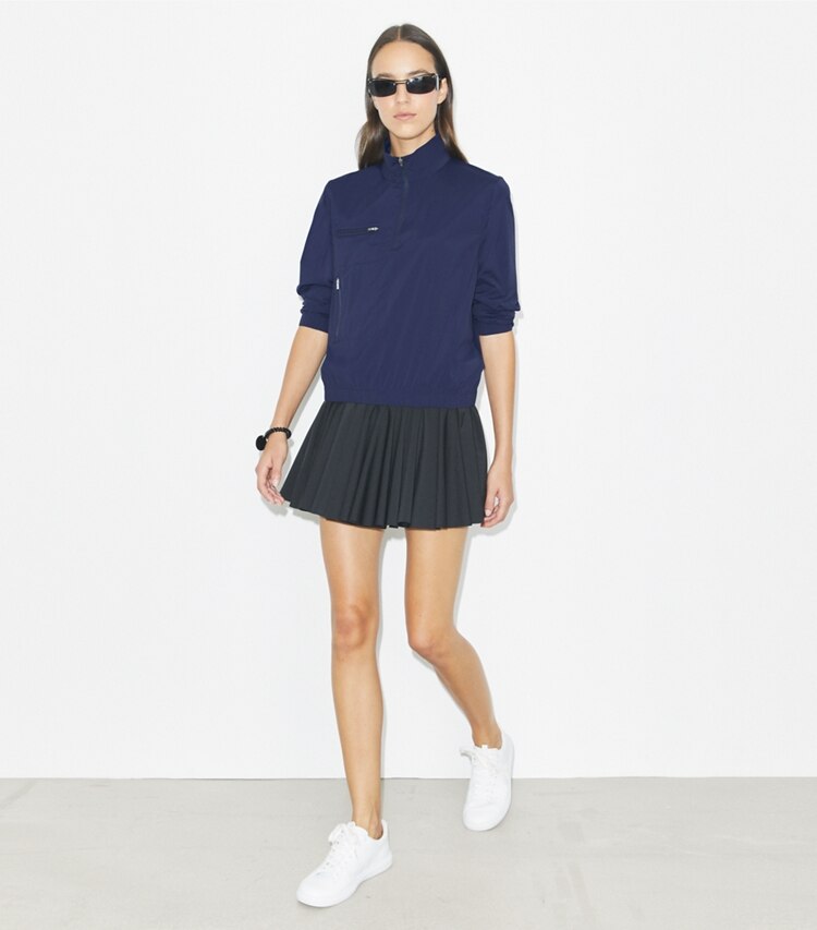 Tory Burch designer bottoms Flounce Jersey Tennis Skirt in Black on model front