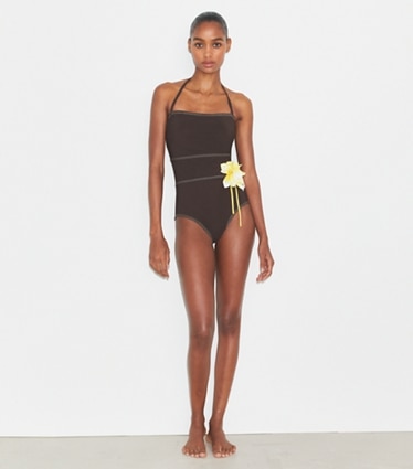 Tory Burch designer one pieces Flower Bandeau Swimsuit in Deep Chocolate on model front