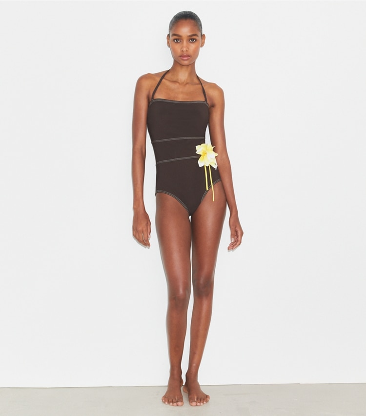 Tory Burch designer one pieces Flower Bandeau Swimsuit in Deep Chocolate on model front