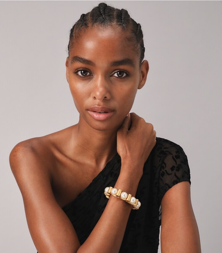 Tory Burch designer earrings Fluted Pearl Cuff in Rolled Brass / Pearl accessory on model