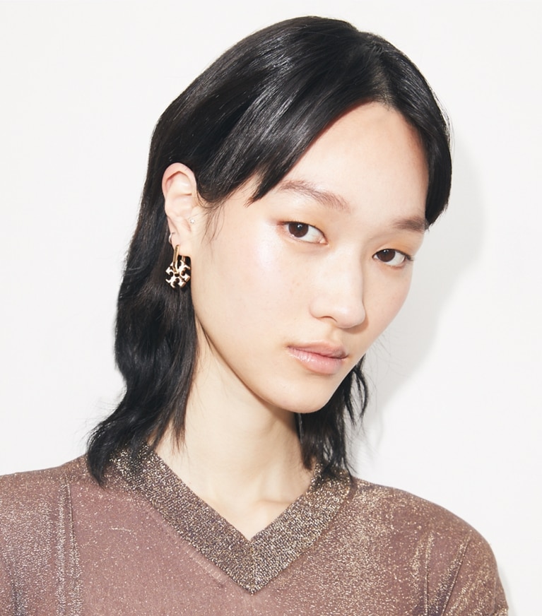 Tory Burch designer earrings Forget Me Not Charm Earrings in Tory Gold / Ivory additional on model