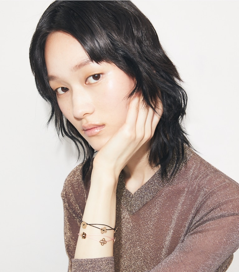 Tory Burch designer bracelets Forget Me Not Cord Bracelet in Black accessory on model