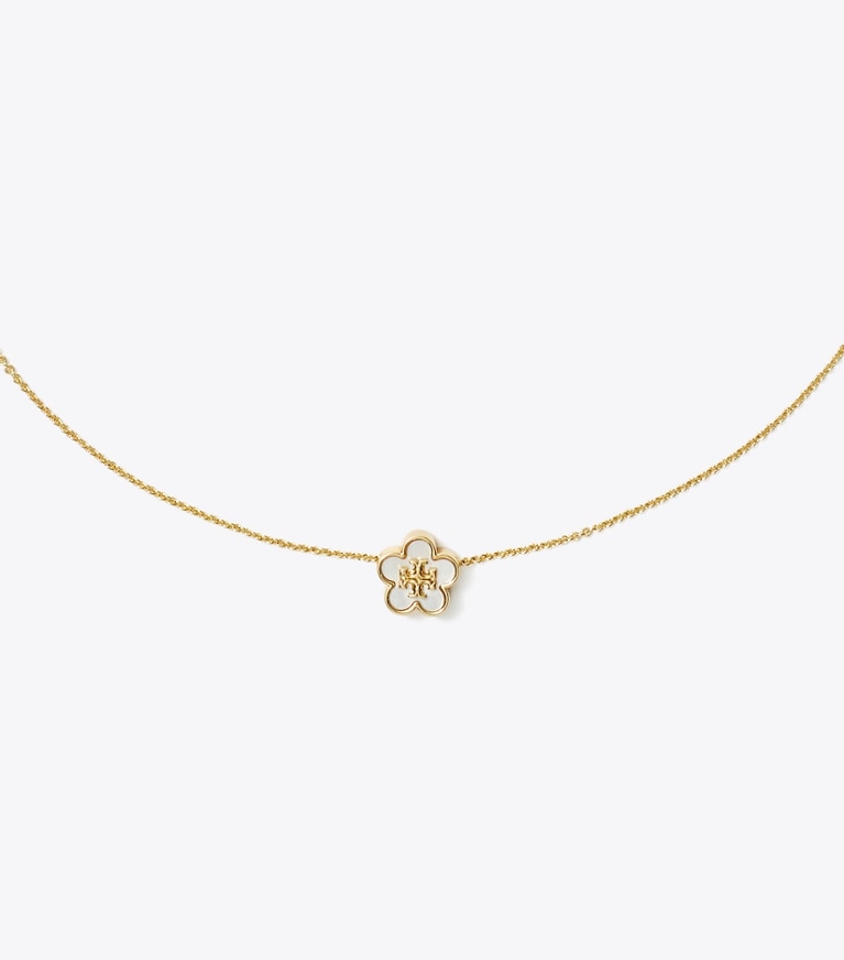 Tory Burch designer halsketten Forget Me Not Halskette mit Blumenanhänger in Tory Gold / Mother of Pearl front