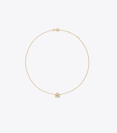 Tory Burch designer halsketten Forget Me Not Halskette mit Blumenanhänger in Tory Gold / Mother of Pearl front