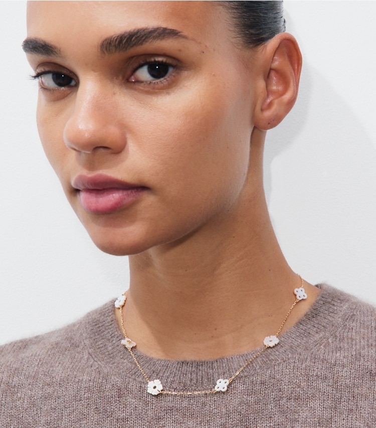 Tory Burch designer necklaces Forget Me Not Necklace in Tory Gold / Mother of Pearl accessory on model
