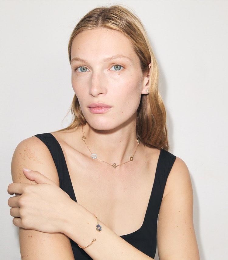 Tory Burch designer necklaces Forget Me Not Pavé Necklace in Tory Gold / Multi accessory on model