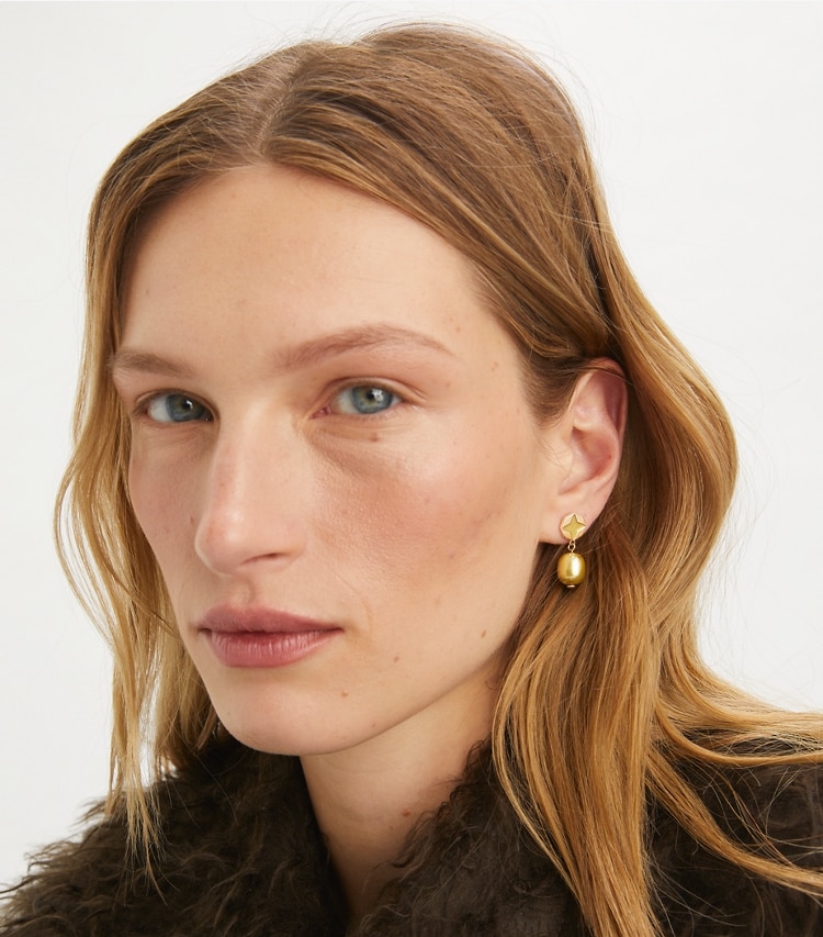 Tory Burch designer earrings Forget Me Not Pearl Drop Earrings in Green / Green accessory on model