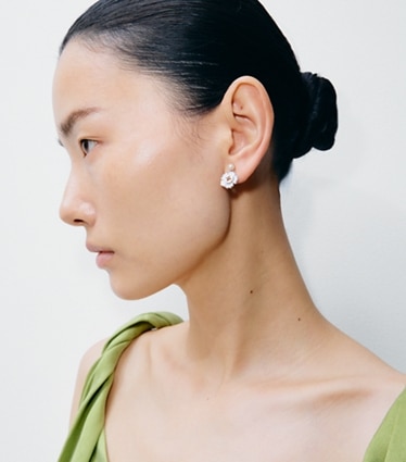 Tory Burch designer earrings Forget Me Not Pearl Drop Earrings in Tory Gold / Blue accessory on model