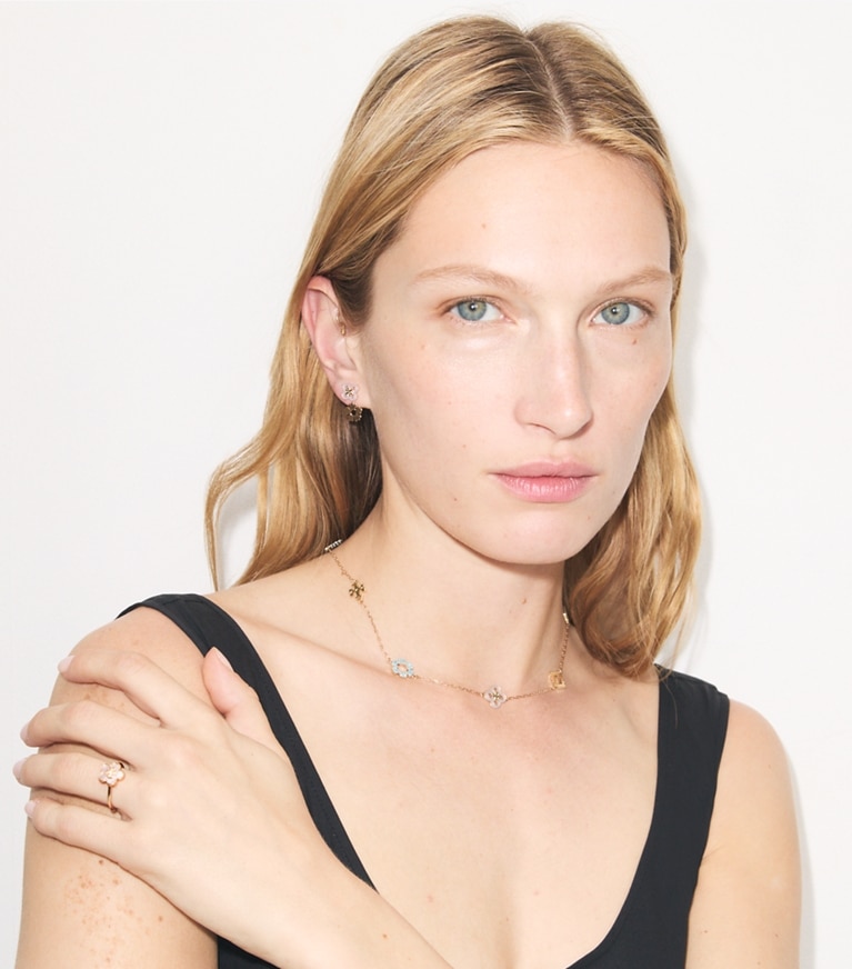 Tory Burch designer rings Forget Me Not Ring in Tory Gold / Mother of Pearl accessory on model