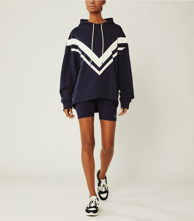 Tory Sport designer sweaters French Terry Chevron Hoodie in Tory Navy on model front