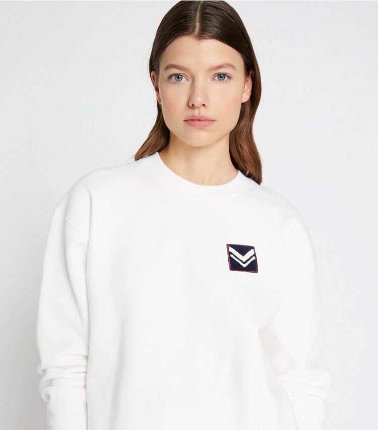 Tory Sport designer sweaters French Terry Chevron Patch Crew in Snow White on model detail
