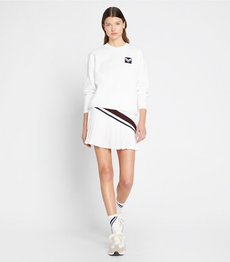Tory Sport designer sweaters French Terry Chevron Patch Crew in Snow White on model front