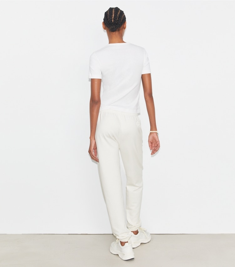 Tory Sport designer bottoms French Terry Cropped Sweatpant in Ivory White on model back
