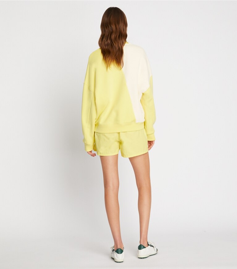 Tory Sport designer sweaters French Terry Diagonal Colorblock Crewneck in Ivory Pearl / Lemon Glow front