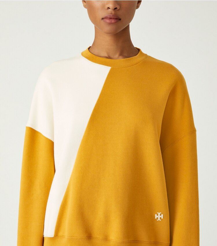 Tory Sport designer sweaters French Terry Diagonal Colorblock Crewneck in Spiced / Ivory Pearl on model detail