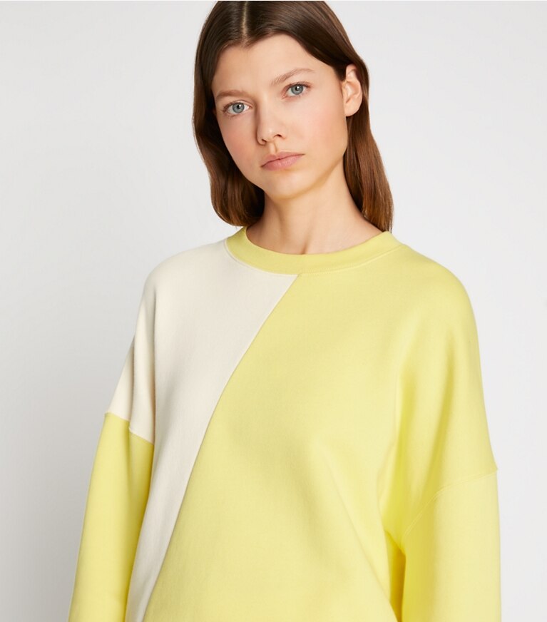 Tory Sport designer sweaters French Terry Diagonal Colorblock Crewneck in Ivory Pearl / Lemon Glow front