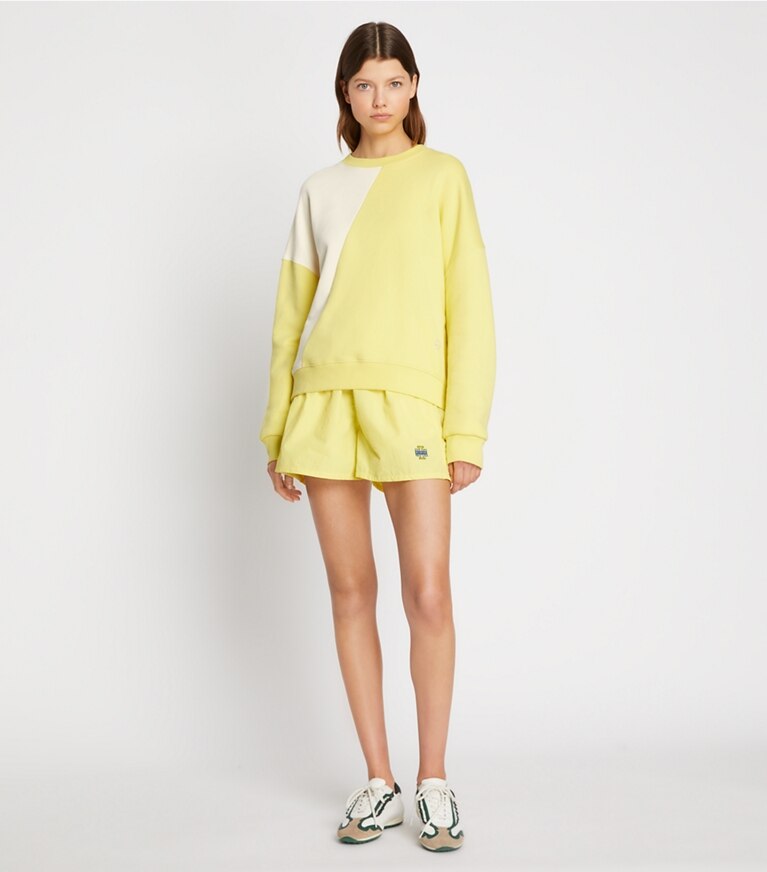Tory Sport designer sweaters French Terry Diagonal Colorblock Crewneck in Ivory Pearl / Lemon Glow front
