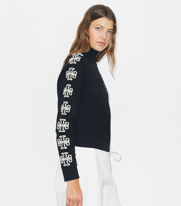 Tory Burch designer sweaters French Terry Logo Sleeve Half-Zip Sweatshirt in Black / New Ivory on model detail