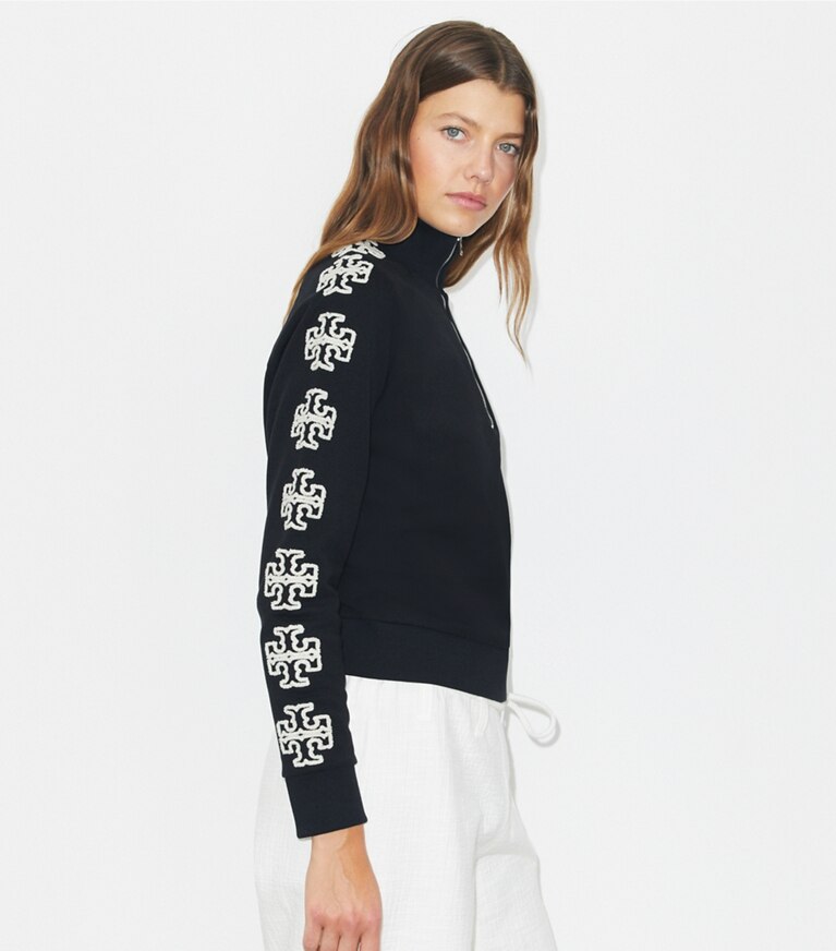 Tory Burch designer sweaters French Terry Logo Sleeve Half-Zip Sweatshirt in Black / New Ivory on model detail