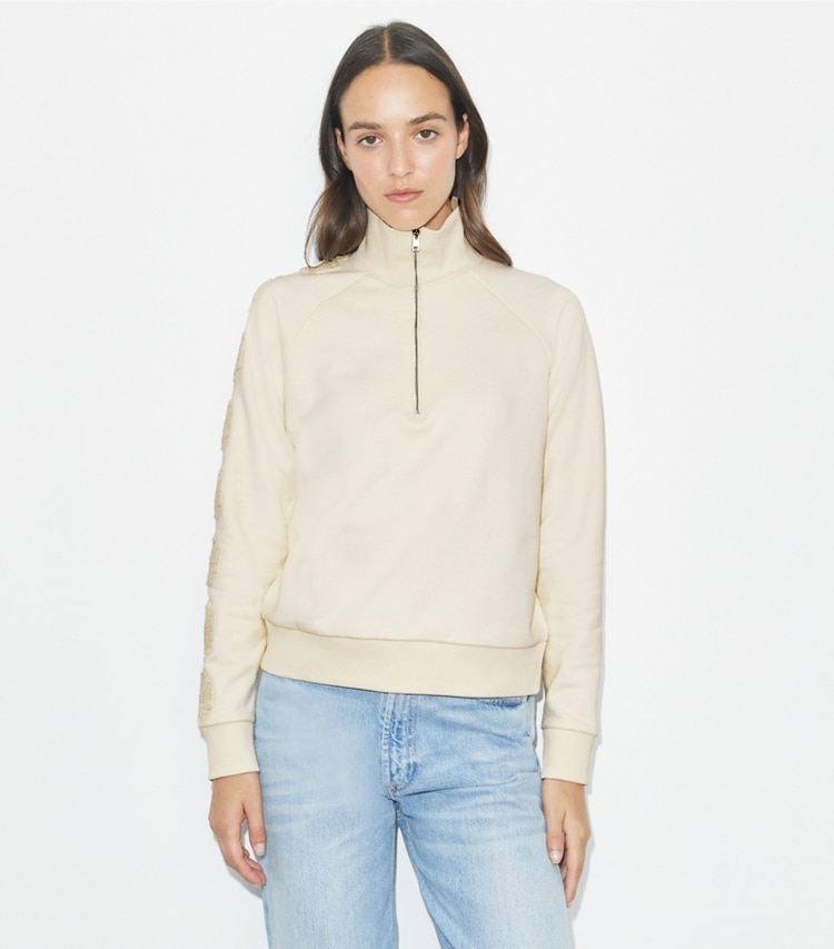 Tory Burch designer セーター フレンチテリー ロゴ スリーブ ハーフジップ スウェットシャツ in New Ivory / New Ivory on model detail