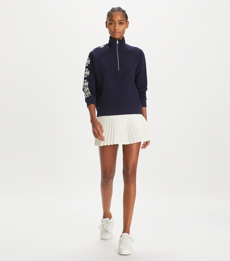 Tory Burch designer sweaters French Terry Logo Sleeve Half-Zip Sweatshirt in Medium Navy on model front